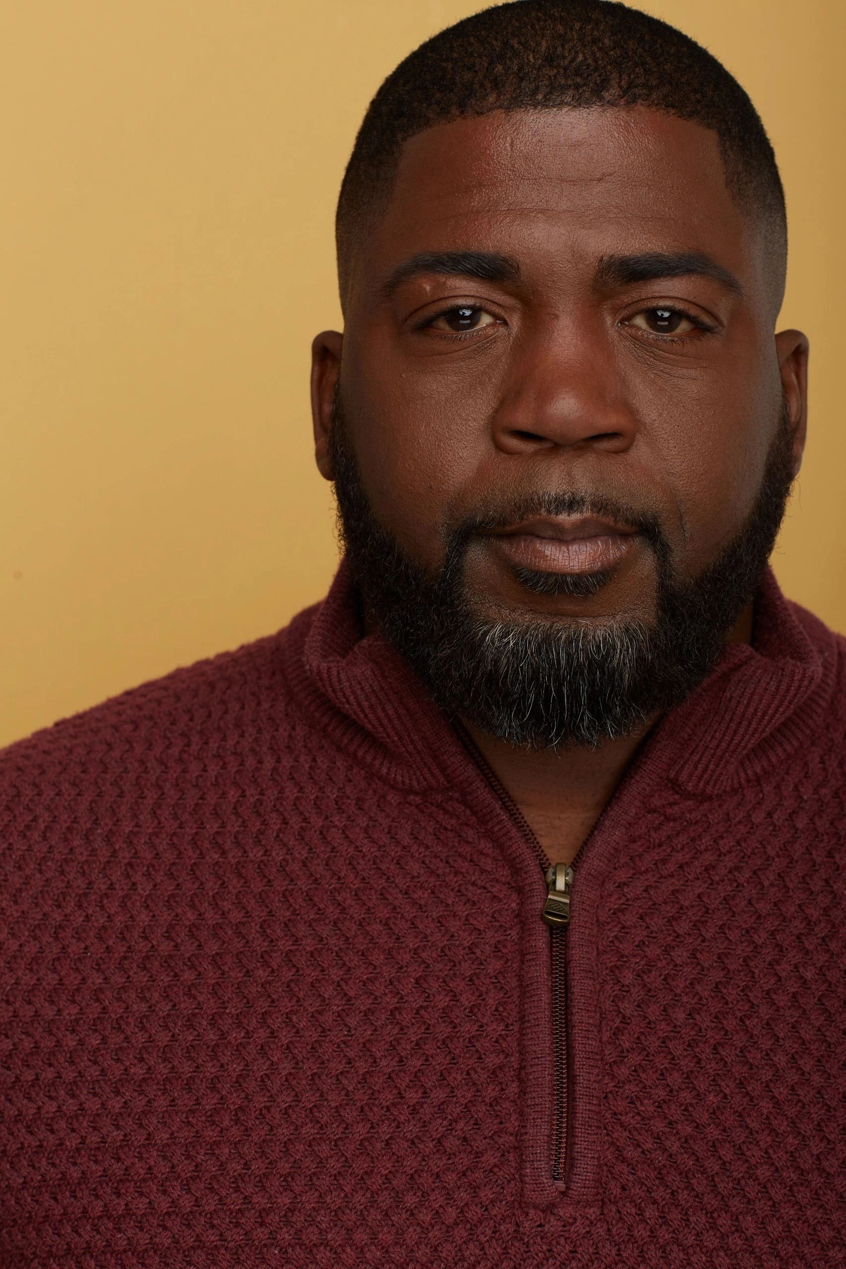 Robert Déon in burgundy sweater